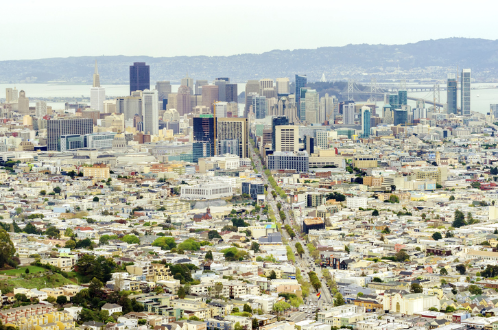 Aerial view of downtown San Francisco city skyline, California, United States of America. A view of Market street in the Castro, LGBT rainbow flag, cityscape, skyscrapers, architecture and bay from Twin Peaks.