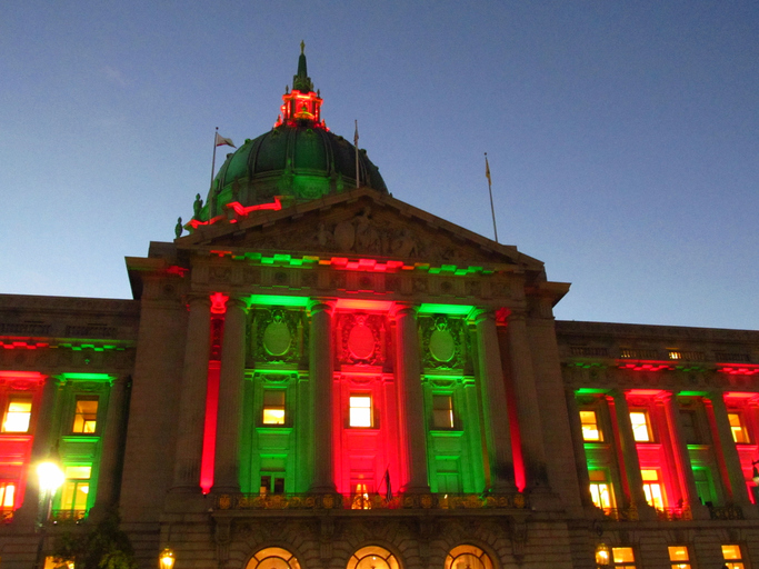 San Francisco City Hall lit up in Christmas colors.